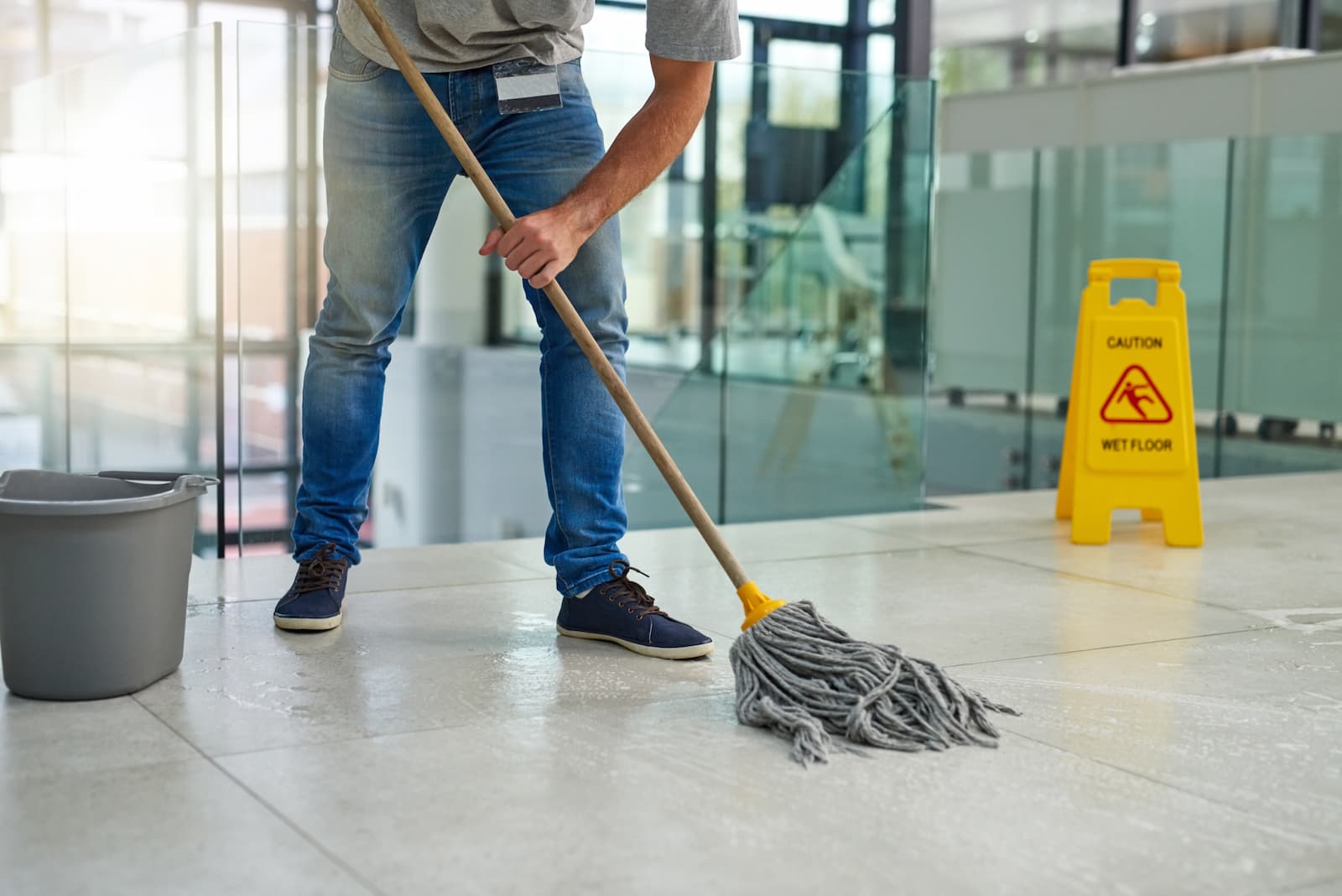 A person mopping a floor